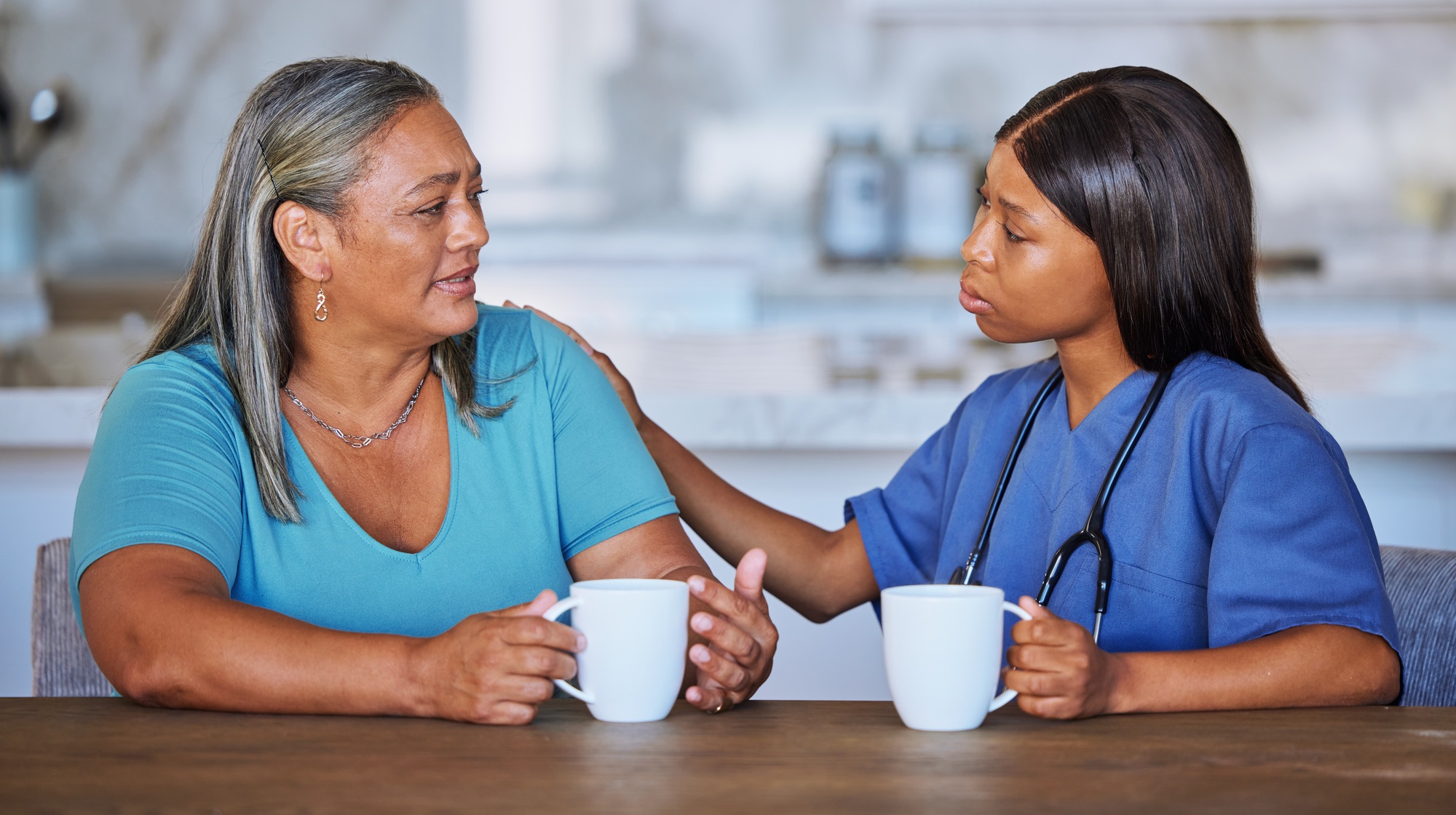 Black woman, nurse or elderly patient support, talking or comfort. Medical consultant, caregiver or